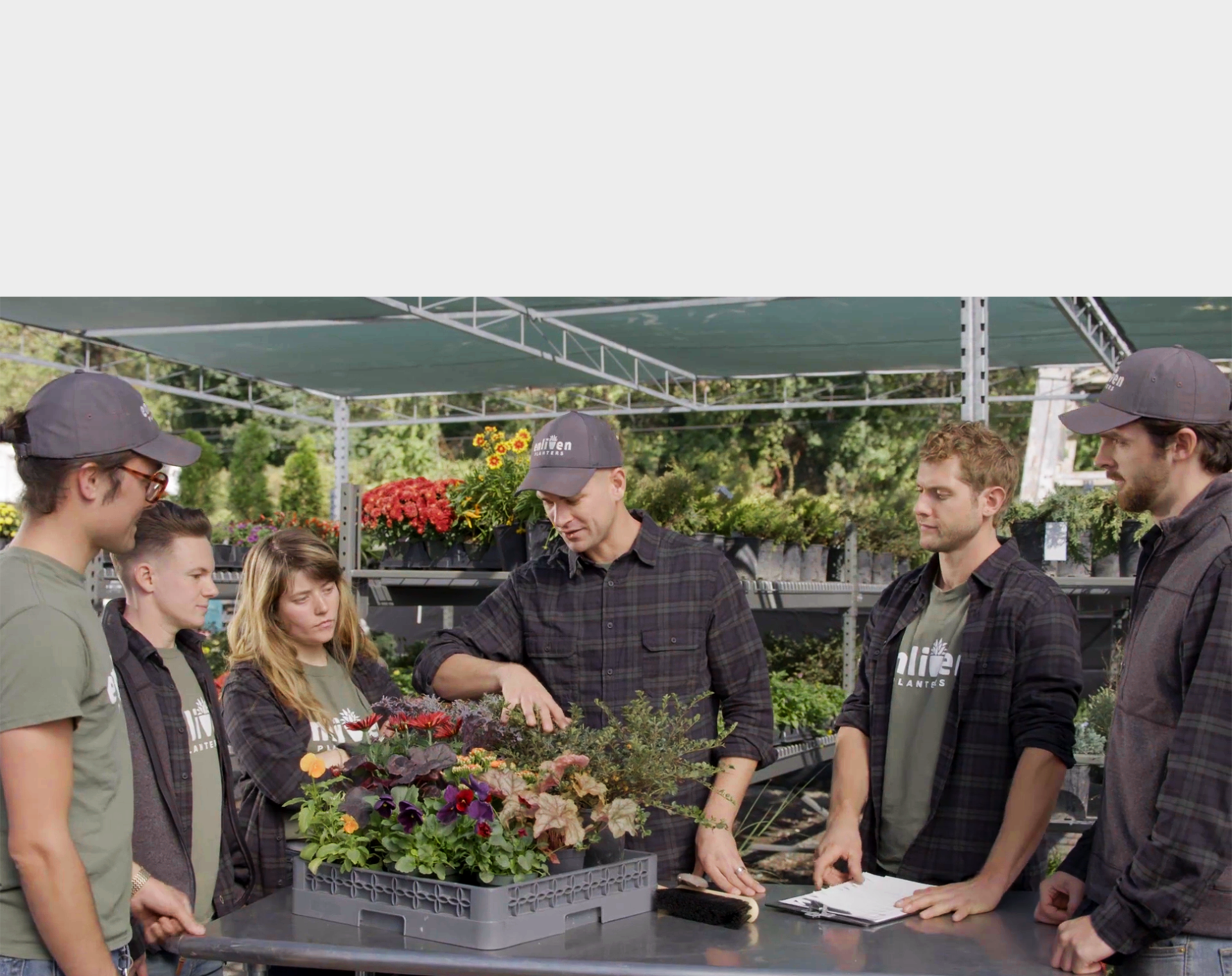 Enliven staff members discussing the season's plant selections